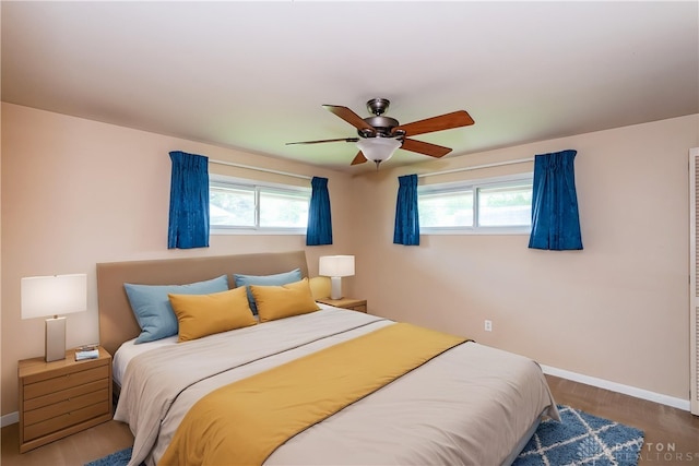 3762 Waterbury Dr, Kettering, OH 45439 - bedroom with multiple windows, baseboards, and ceiling fan