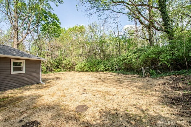 view of yard with a forest view