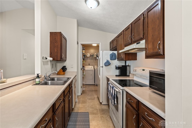 108 Mallard Glen Dr Unit 7, Dayton, OH 45458 - kitchen with under cabinet range hood, white range with electric stovetop, separate washer and dryer, vaulted ceiling, and a sink