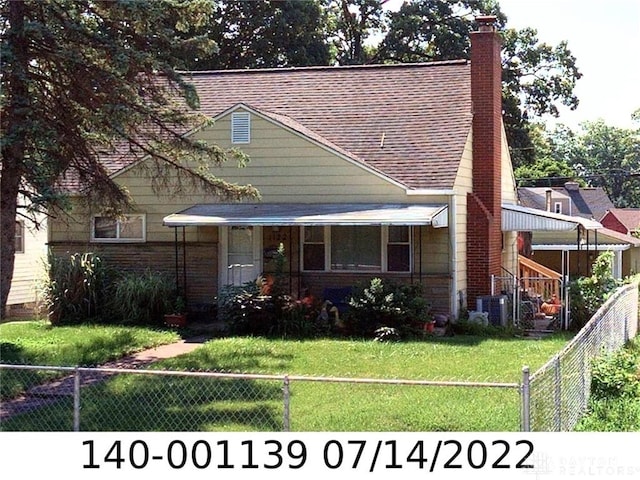 1122 Harrisburg Pike, Columbus, OH 43223 - bungalow-style home with a chimney, roof with shingles, and cooling unit