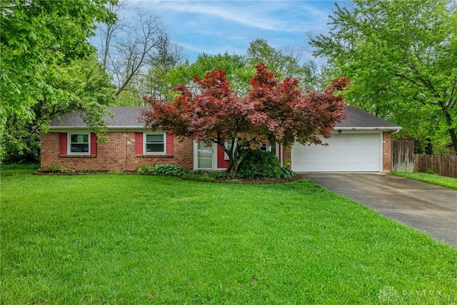2084 Firebird Dr, Bellbrook, OH 45305 - view of front facade with driveway, an attached garage, brick siding, and roof with shingles