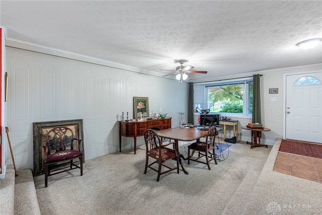 2084 Firebird Dr, Bellbrook, OH 45305 - dining area with ceiling fan, crown molding, light carpet, and a textured ceiling