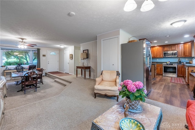 2084 Firebird Dr, Bellbrook, OH 45305 - living room featuring a textured ceiling, ceiling fan, and carpet flooring