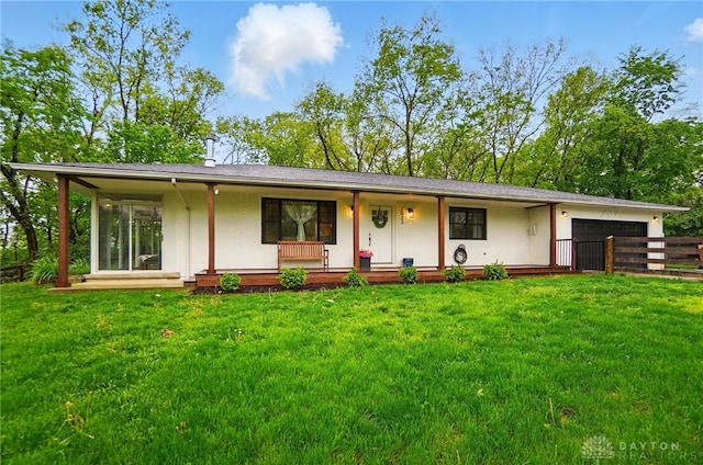 2023 W State Route 63, Lebanon, OH 45036 - view of front facade featuring a porch, an attached garage, and a front lawn