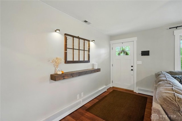 2023 W State Route 63, Lebanon, OH 45036 - entrance foyer with healthy amount of natural light, wood finished floors, a barn door, and baseboards
