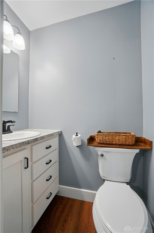 2023 W State Route 63, Lebanon, OH 45036 - bathroom with wood finished floors, baseboards, vanity, and toilet