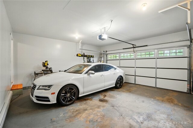 2023 W State Route 63, Lebanon, OH 45036 - garage featuring a garage door opener and a baseboard radiator