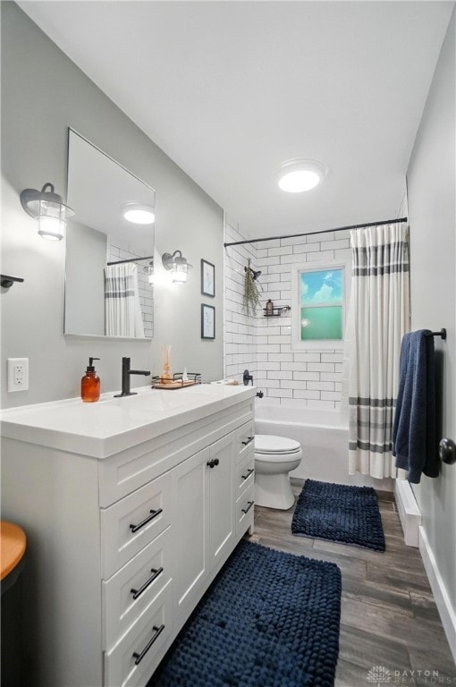 2023 W State Route 63, Lebanon, OH 45036 - full bathroom with toilet, wood finished floors, shower / bath combo with shower curtain, and vanity