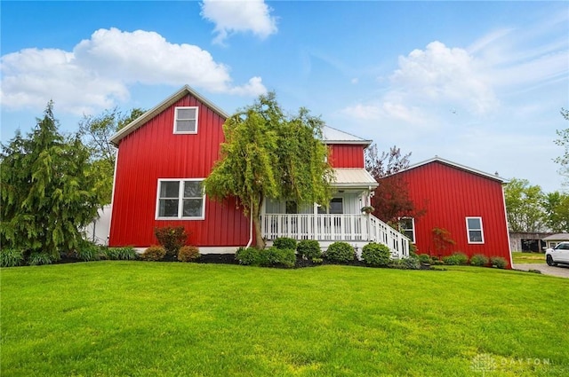 6859 US Highway 62 NE, Washington Court Hous, OH 43160 - rear view of property with covered porch, a lawn, and board and batten siding