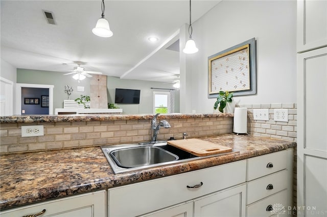 6859 US Highway 62 NE, Washington Court Hous, OH 43160 - kitchen with a ceiling fan, a sink, tasteful backsplash, and white cabinetry