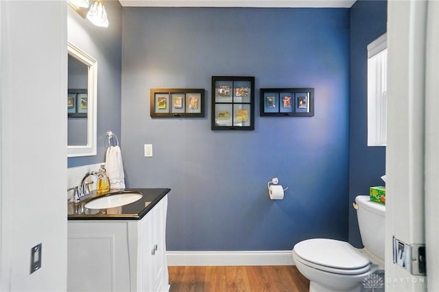 6859 US Highway 62 NE, Washington Court Hous, OH 43160 - half bath with toilet, baseboards, vanity, and wood finished floors