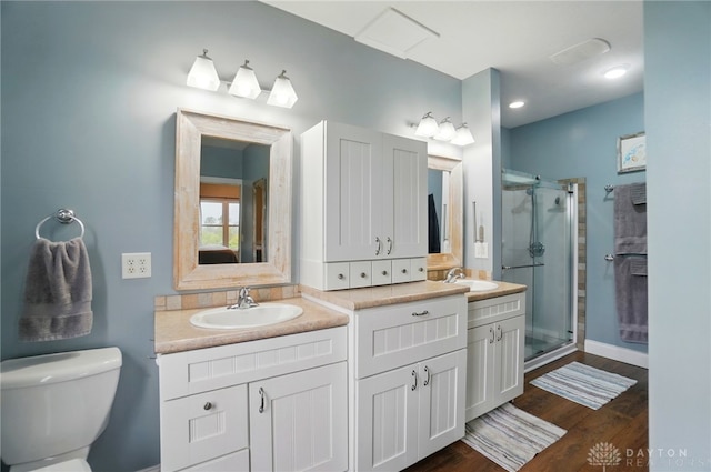 6859 US Highway 62 NE, Washington Court Hous, OH 43160 - bathroom with a stall shower, double vanity, toilet, and wood finished floors