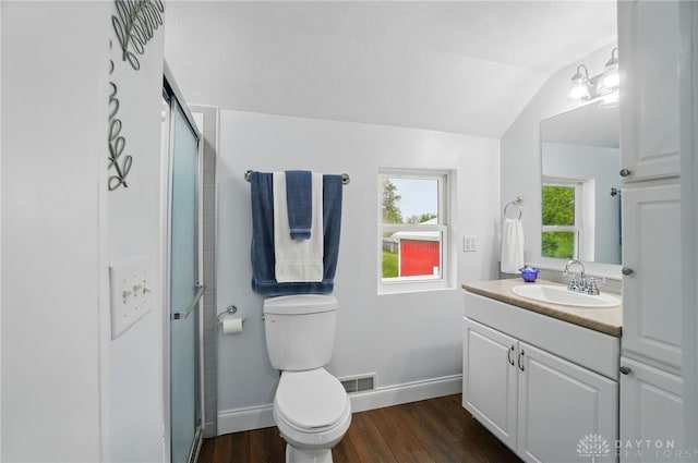 6859 US Highway 62 NE, Washington Court Hous, OH 43160 - bathroom with lofted ceiling, toilet, wood finished floors, vanity, and an enclosed shower