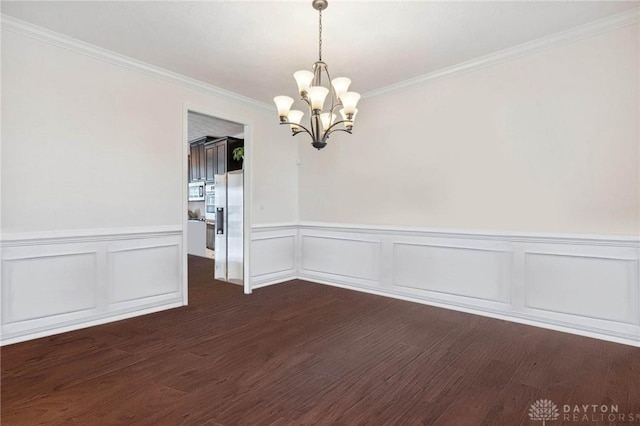 10280 Benjamin Way, Washington Twp, OH 45458 - empty room featuring dark wood finished floors, a chandelier, ornamental molding, a wainscoted wall, and a decorative wall