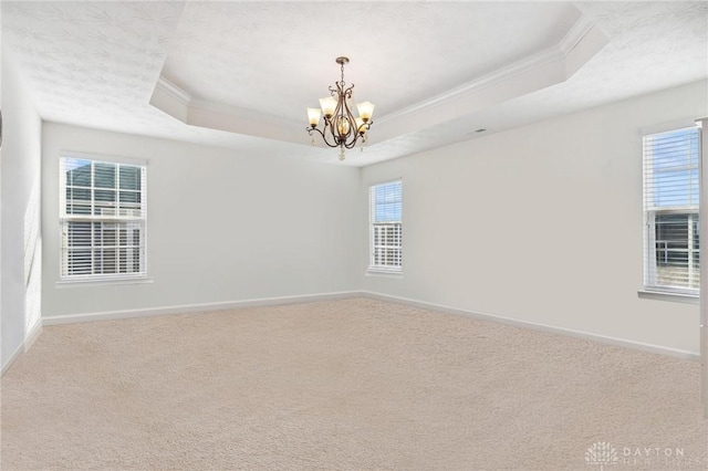 10280 Benjamin Way, Washington Twp, OH 45458 - unfurnished room with crown molding, a chandelier, a tray ceiling, baseboards, and carpet floors