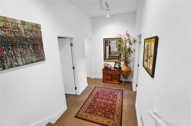 1900 Kresswood Cir, Kettering, OH 45429 - hallway featuring tile patterned flooring, baseboards, and a high ceiling