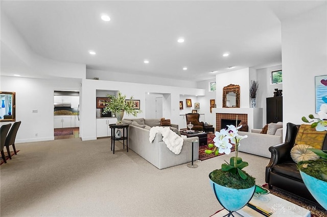 1900 Kresswood Cir, Kettering, OH 45429 - living room with carpet floors, recessed lighting, a tile fireplace, and baseboards