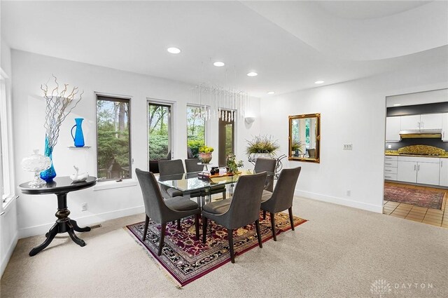 1900 Kresswood Cir, Kettering, OH 45429 - dining room featuring recessed lighting, baseboards, light colored carpet, and light tile patterned flooring
