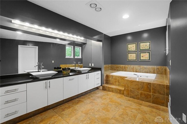 1900 Kresswood Cir, Kettering, OH 45429 - full bathroom featuring double vanity, a garden tub, and tile patterned flooring