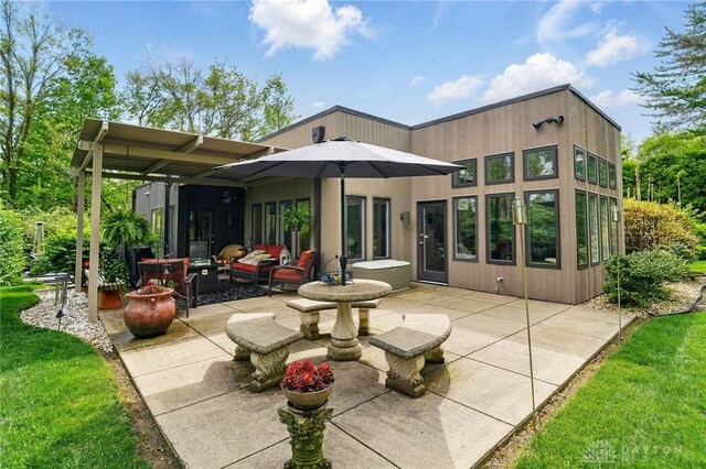 1900 Kresswood Cir, Kettering, OH 45429 - back of house with a patio and outdoor lounge area