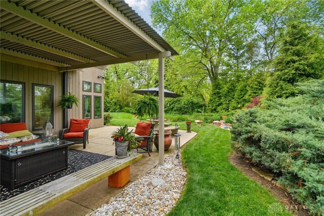 1900 Kresswood Cir, Kettering, OH 45429 - view of green lawn with a patio area, an outdoor hangout area, and a pergola