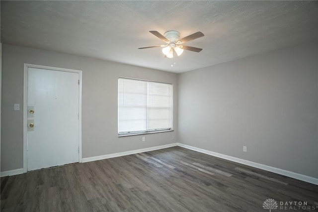 2525 Lakeview Ave, Dayton, OH 45417 - unfurnished room with a ceiling fan, dark wood-style floors, and baseboards