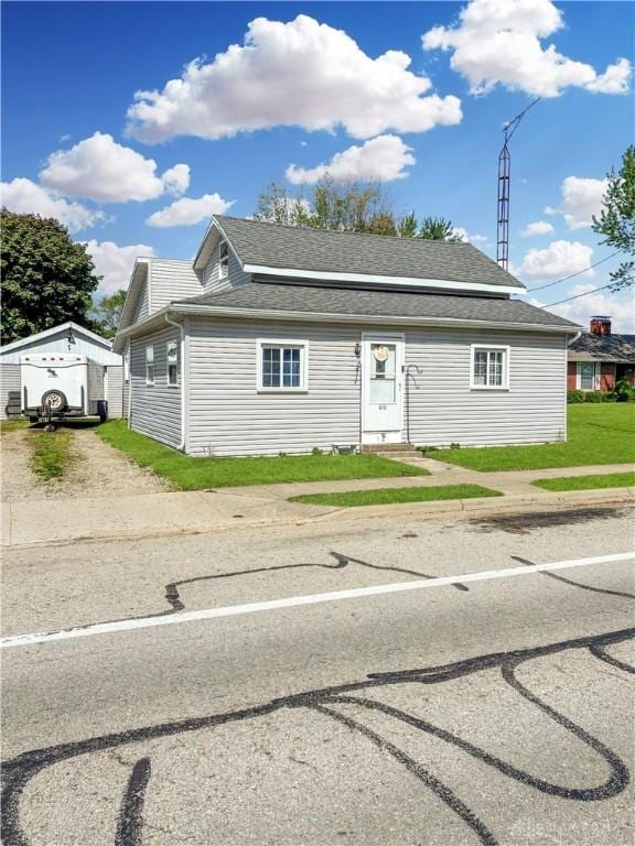 616 N Main St, Ansonia, OH 45303 - view of front of house featuring dirt driveway and an outbuilding
