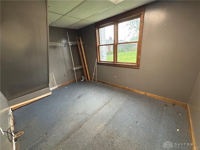 616 N Main St, Ansonia, OH 45303 - unfurnished bedroom featuring baseboards, carpet floors, a closet, and a paneled ceiling