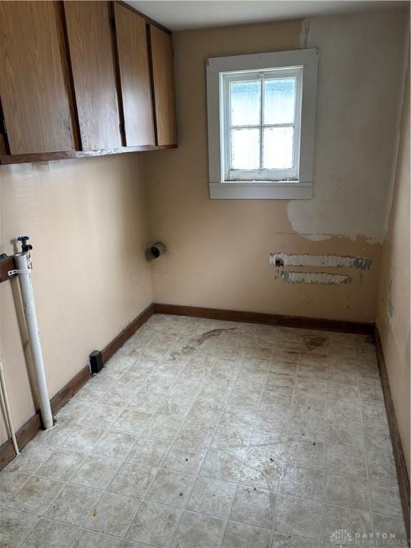 616 N Main St, Ansonia, OH 45303 - laundry area with cabinet space and baseboards