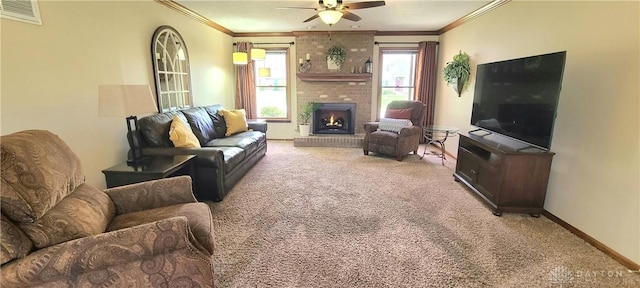 6765 Montpellier Blvd, Centerville, OH 45459 - living room featuring carpet floors, ceiling fan, crown molding, a brick fireplace, and baseboards