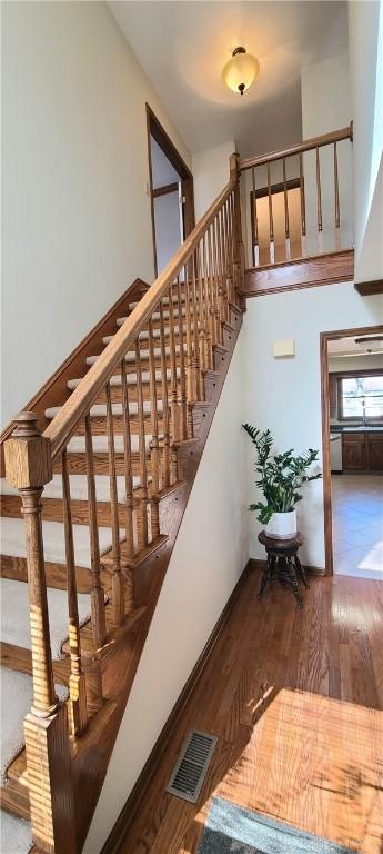 6765 Montpellier Blvd, Centerville, OH 45459 - stairway featuring wood finished floors and a high ceiling