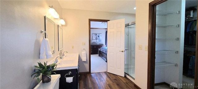 6765 Montpellier Blvd, Centerville, OH 45459 - ensuite bathroom featuring wood finished floors, a stall shower, vanity, and a spacious closet