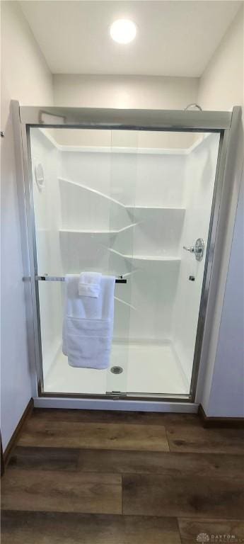 6765 Montpellier Blvd, Centerville, OH 45459 - bathroom featuring wood finished floors, a shower stall, and baseboards