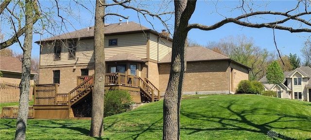 6765 Montpellier Blvd, Centerville, OH 45459 - rear view of property with stairway, brick siding, a wooden deck, and a lawn