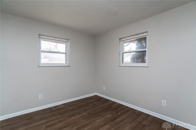 2525 Germantown St, Dayton, OH 45417 - unfurnished room featuring baseboards and dark wood-type flooring