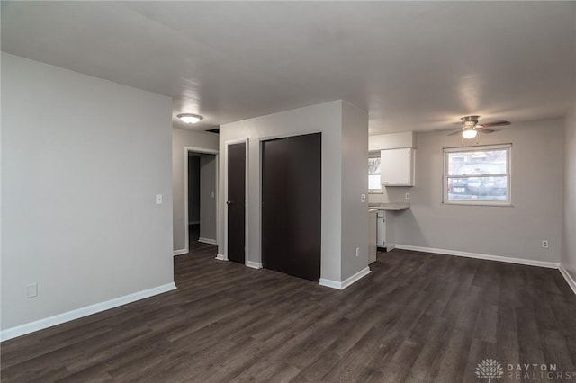 2525 Germantown St, Dayton, OH 45417 - unfurnished living room featuring dark wood-style floors, ceiling fan, and baseboards