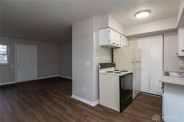 2525 Germantown St, Dayton, OH 45417 - kitchen featuring electric stove, light countertops, dark wood finished floors, a sink, and baseboards