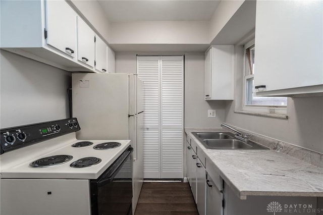 2525 Germantown St, Dayton, OH 45417 - kitchen featuring electric range, a sink, light countertops, and white cabinets