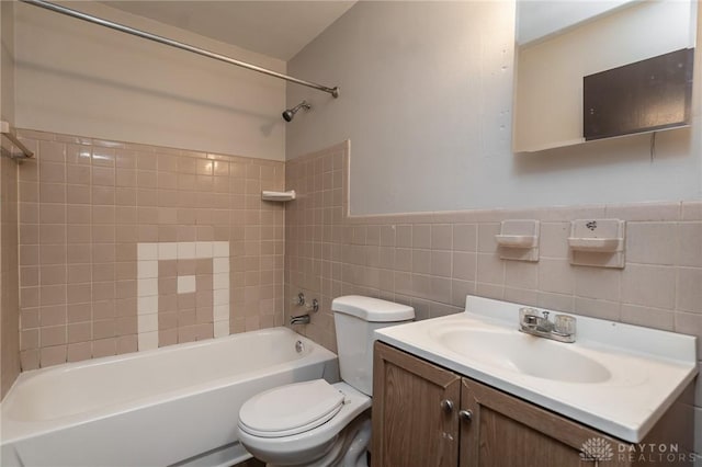 2525 Germantown St, Dayton, OH 45417 - full bathroom featuring tile walls, toilet, washtub / shower combination, and vanity