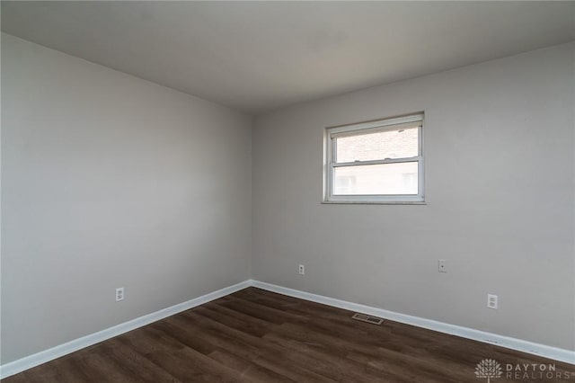 2525 Germantown St, Dayton, OH 45417 - empty room with dark wood finished floors and baseboards