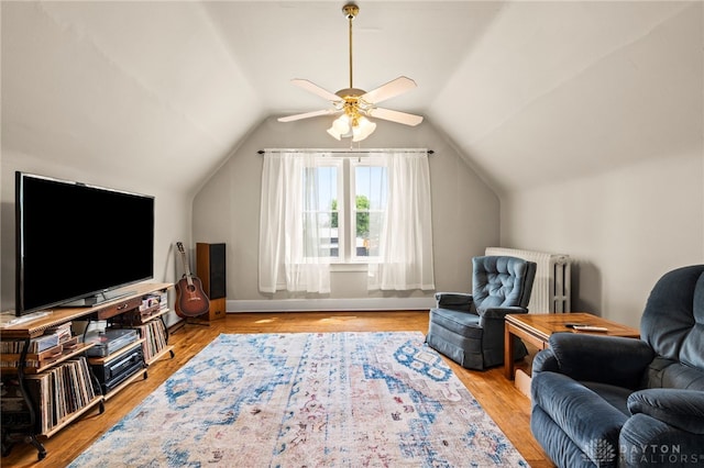 654 S Market St, Troy, OH 45373 - sitting room with a ceiling fan, vaulted ceiling, wood finished floors, radiator, and baseboards