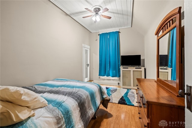 654 S Market St, Troy, OH 45373 - bedroom with wood finished floors, lofted ceiling, and a ceiling fan