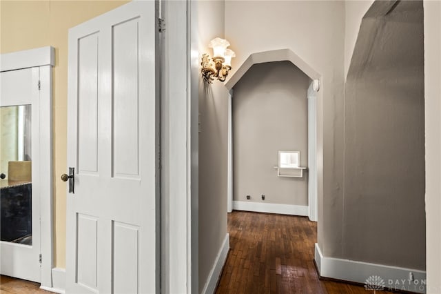 654 S Market St, Troy, OH 45373 - hall featuring wood-type flooring, baseboards, and arched walkways
