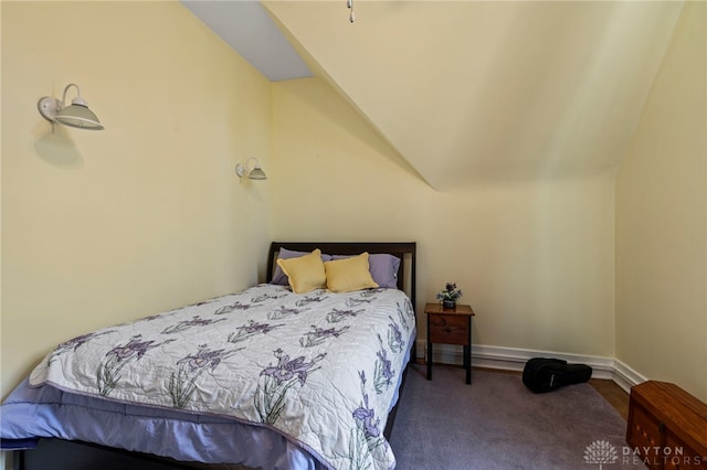 654 S Market St, Troy, OH 45373 - bedroom with lofted ceiling, baseboards, and carpet flooring