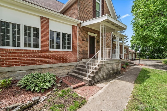 654 S Market St, Troy, OH 45373 - entrance to property with brick siding and roof with shingles