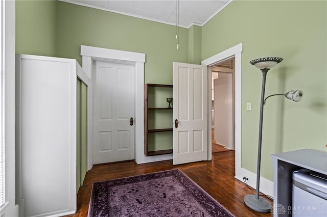 654 S Market St, Troy, OH 45373 - bedroom with dark wood-type flooring, crown molding, and baseboards