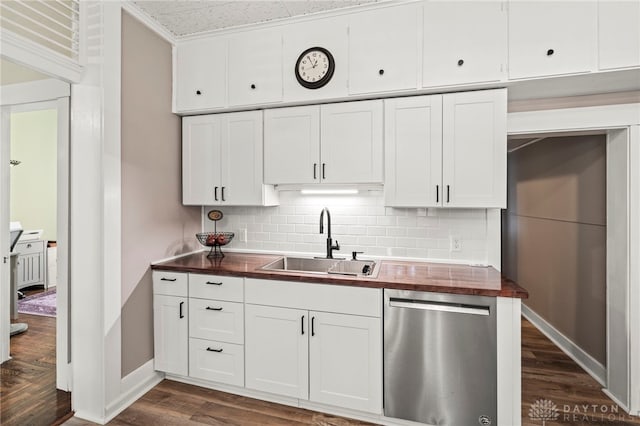 654 S Market St, Troy, OH 45373 - kitchen with stainless steel dishwasher, a sink, wood counters, dark wood-type flooring, and decorative backsplash