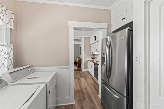 654 S Market St, Troy, OH 45373 - laundry area featuring separate washer and dryer, dark wood finished floors, wainscoting, and crown molding