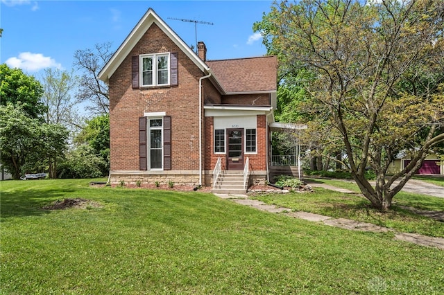 654 S Market St, Troy, OH 45373 - view of front facade with a chimney, brick siding, and a front lawn