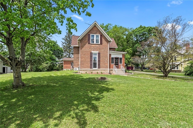654 S Market St, Troy, OH 45373 - back of property featuring brick siding and a lawn